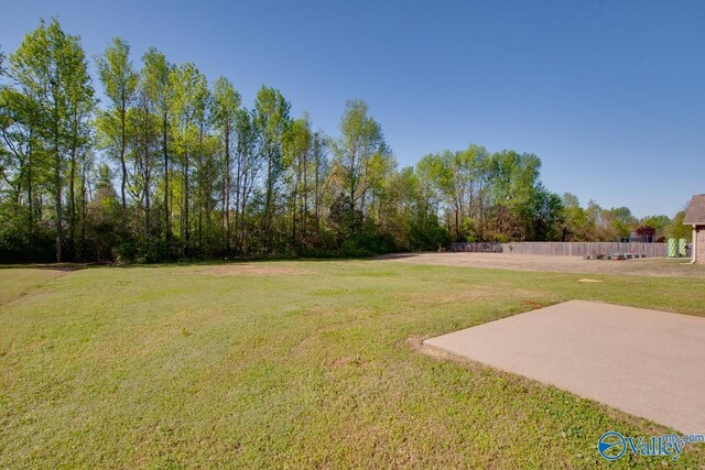 view of yard with fence and a patio area