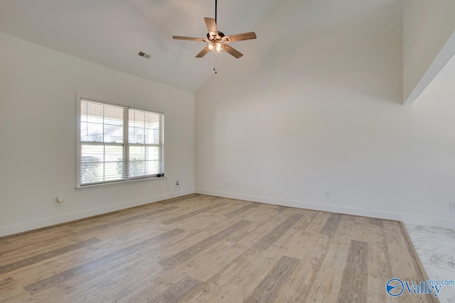 unfurnished room with ceiling fan, high vaulted ceiling, and light wood-type flooring