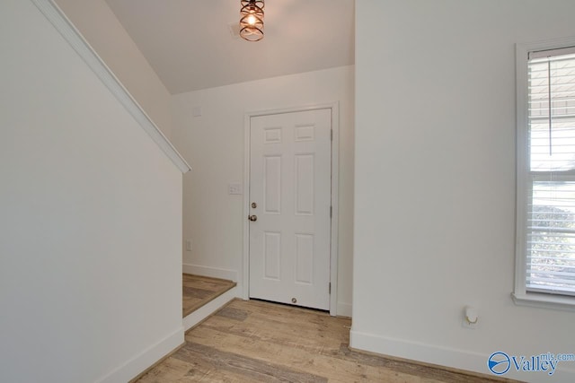 foyer entrance with light hardwood / wood-style flooring