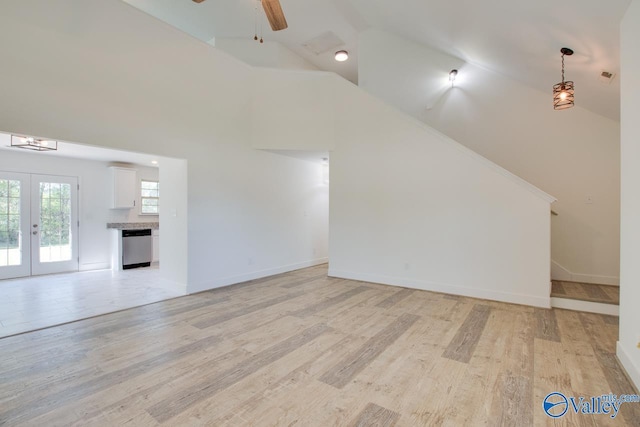 unfurnished living room featuring french doors, ceiling fan, high vaulted ceiling, and light hardwood / wood-style flooring