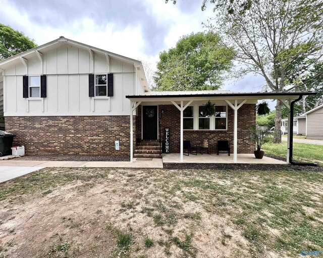 229 Crawford Rd, Scottsboro, AL 35769 - tri-level home featuring board and batten siding and brick siding