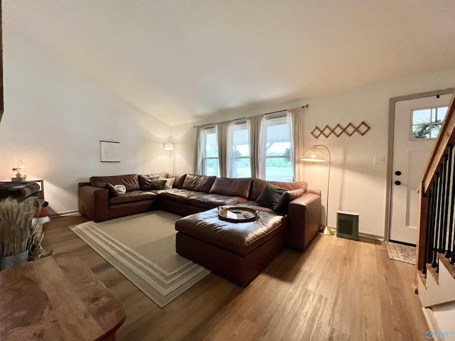 229 Crawford Rd, Scottsboro, AL 35769 - living area with lofted ceiling, plenty of natural light, light wood-style floors, and stairs
