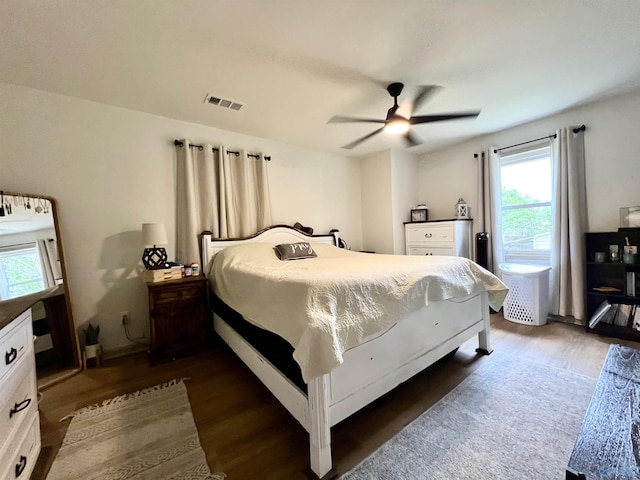 229 Crawford Rd, Scottsboro, AL 35769 - bedroom featuring ceiling fan, dark wood-style flooring, multiple windows, and visible vents