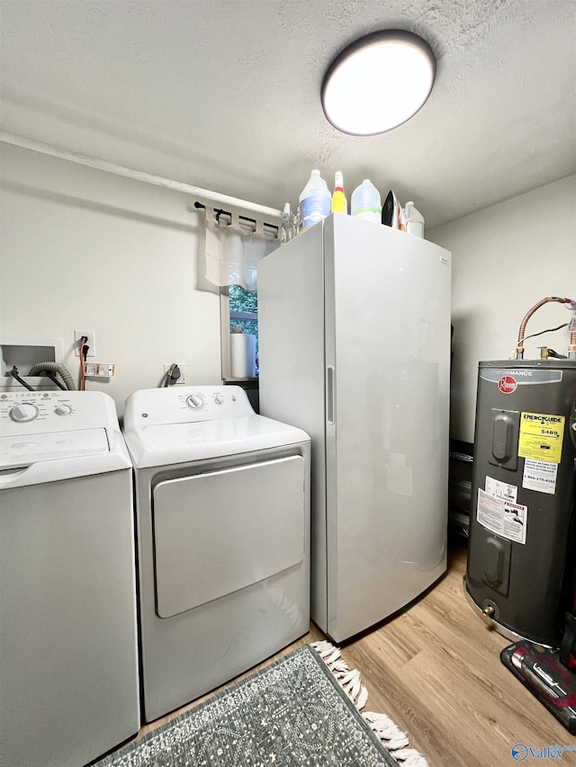 229 Crawford Rd, Scottsboro, AL 35769 - laundry area featuring light wood-type flooring, water heater, washer and dryer, and laundry area