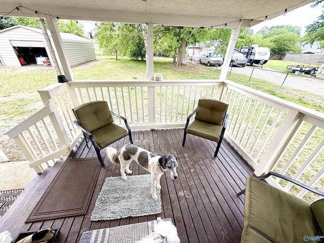 229 Crawford Rd, Scottsboro, AL 35769 - deck featuring a lawn, a porch, and an outbuilding