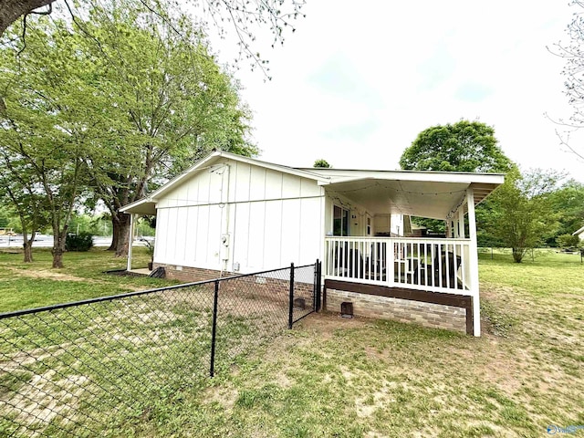 229 Crawford Rd, Scottsboro, AL 35769 - view of home's exterior featuring fence, a yard, and crawl space