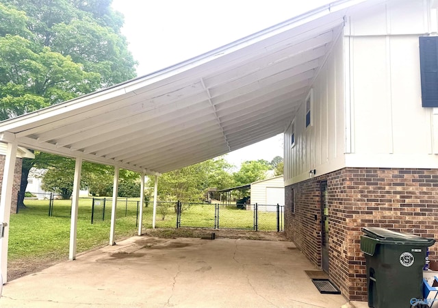 229 Crawford Rd, Scottsboro, AL 35769 - view of vehicle parking featuring a gate, fence, and a carport