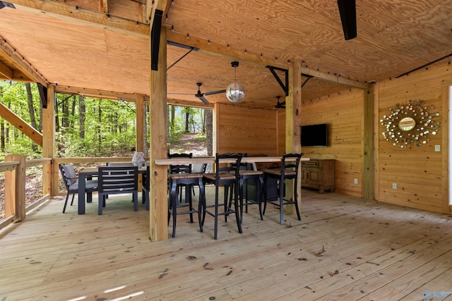 wooden deck featuring ceiling fan