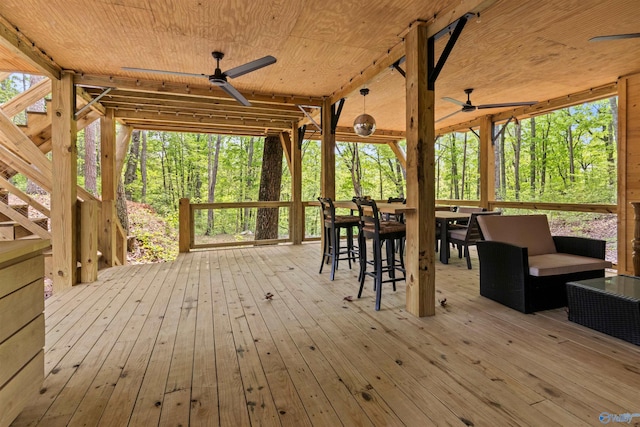 wooden deck featuring ceiling fan