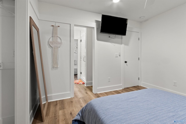 bedroom with light hardwood / wood-style flooring