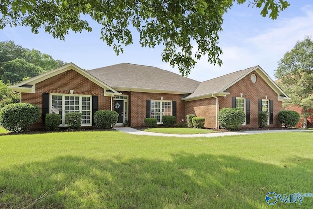 2624 Bransford Trl, Owens Cross Roads, AL 35763 - view of front of home with a front lawn, brick siding, and roof with shingles