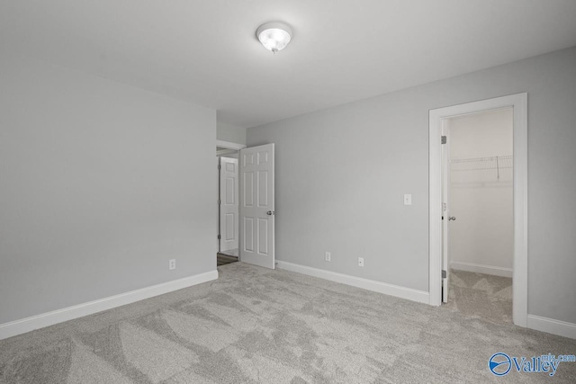 2624 Bransford Trl, Owens Cross Roads, AL 35763 - unfurnished bedroom featuring carpet floors, a spacious closet, baseboards, and a closet