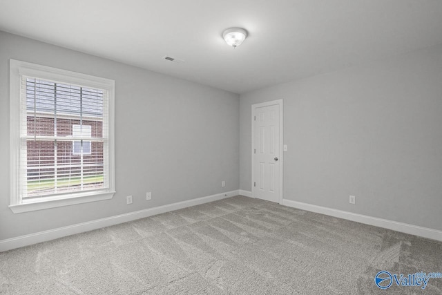 2624 Bransford Trl, Owens Cross Roads, AL 35763 - carpeted empty room featuring baseboards and plenty of natural light