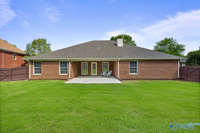 2624 Bransford Trl, Owens Cross Roads, AL 35763 - back of property with a patio, a chimney, brick siding, a gate, and a shingled roof
