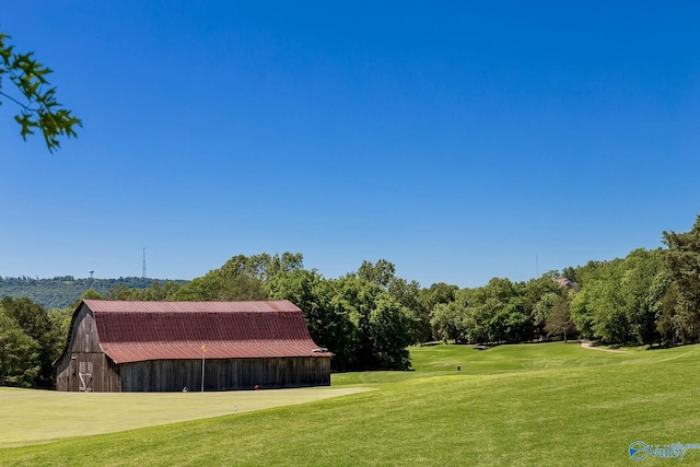 2624 Bransford Trl, Owens Cross Roads, AL 35763 - view of grassy yard featuring a barn, an outbuilding, and golf course view
