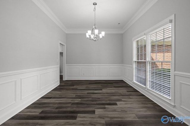 2624 Bransford Trl, Owens Cross Roads, AL 35763 - unfurnished dining area with a chandelier, crown molding, wainscoting, dark wood finished floors, and a decorative wall