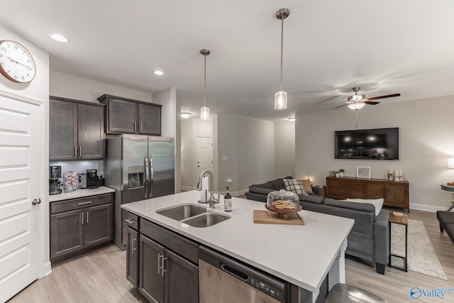 4018 SE Rockland Cir, Owens Cross Roads, AL 35763 - kitchen with a sink, stainless steel appliances, open floor plan, light wood-style flooring, and recessed lighting