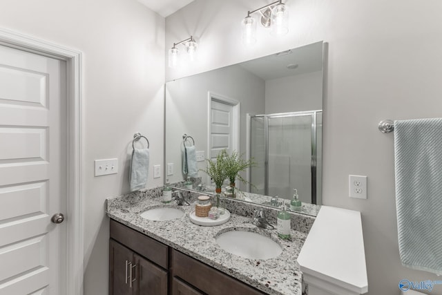 4018 SE Rockland Cir, Owens Cross Roads, AL 35763 - bathroom featuring a stall shower and double vanity