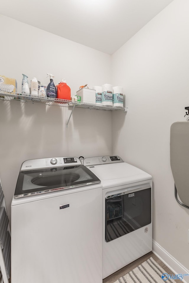 4018 SE Rockland Cir, Owens Cross Roads, AL 35763 - laundry area with washer and clothes dryer and baseboards