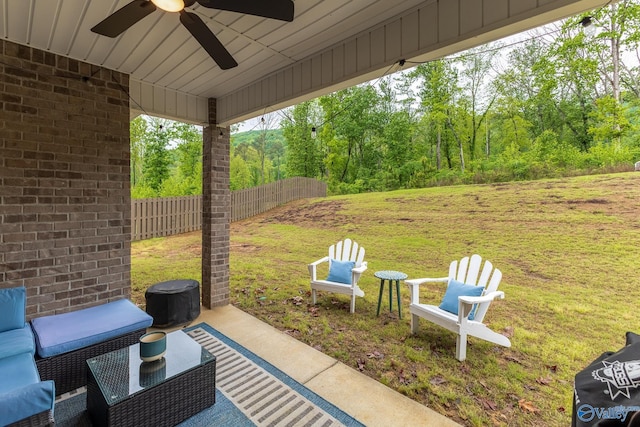 4018 SE Rockland Cir, Owens Cross Roads, AL 35763 - view of patio / terrace featuring ceiling fan, outdoor lounge area, and a forest view