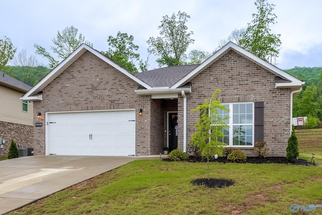 4018 SE Rockland Cir, Owens Cross Roads, AL 35763 - single story home with brick siding, an attached garage, concrete driveway, a front lawn, and cooling unit