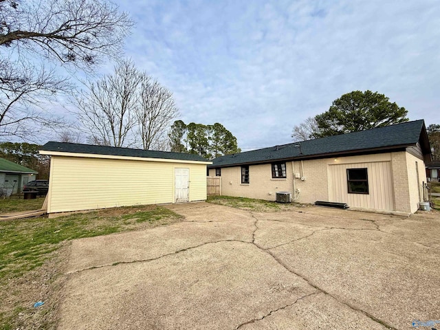 back of house with a patio and central AC