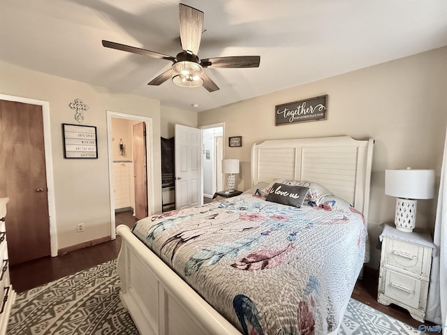 bedroom featuring ceiling fan, dark hardwood / wood-style flooring, and ensuite bath