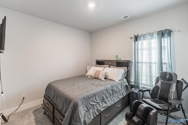 bedroom with carpet floors, baseboards, and visible vents