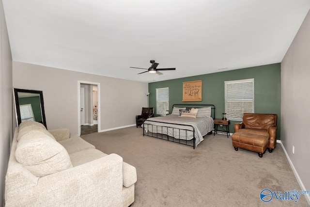 bedroom with ceiling fan, carpet, and baseboards