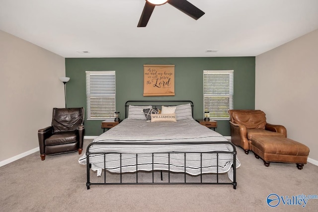 carpeted bedroom featuring visible vents, ceiling fan, and baseboards