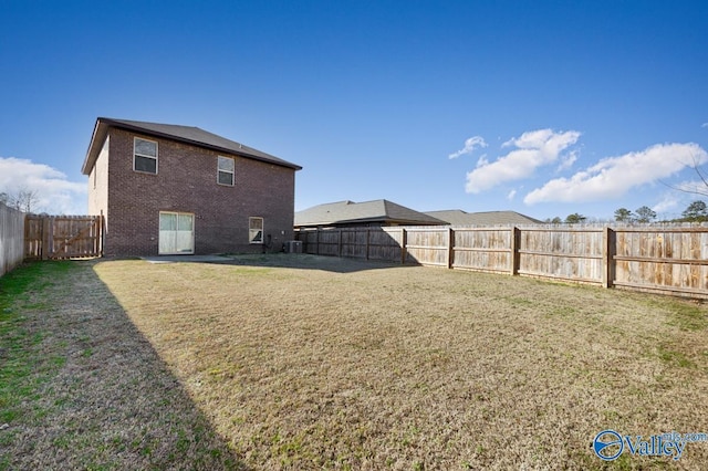 view of yard with a fenced backyard