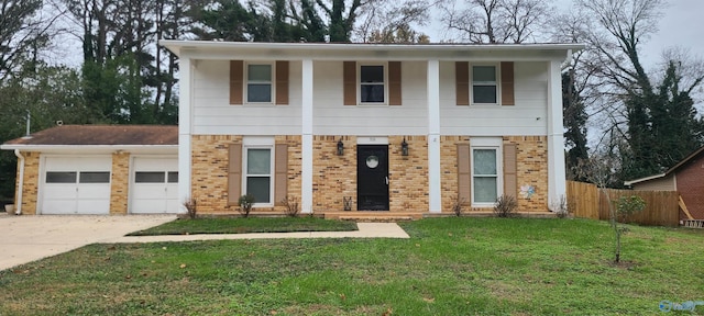 view of front of home with a garage and a front yard