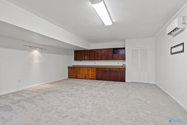 kitchen featuring light carpet, a wall mounted air conditioner, and crown molding