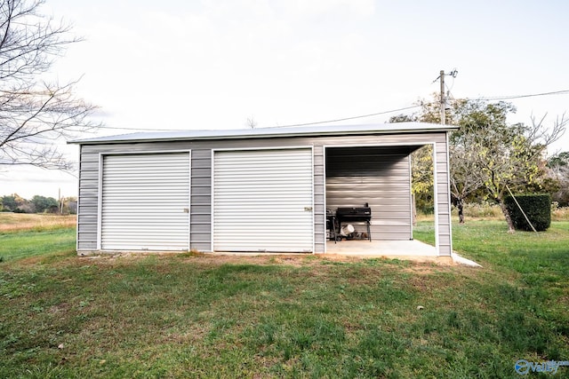 garage featuring a yard