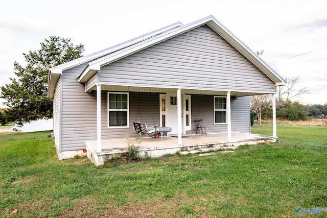 bungalow-style home featuring a porch and a front lawn