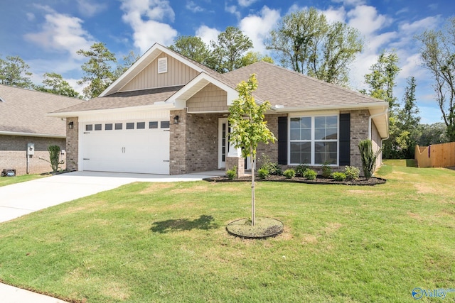 view of front of house featuring a garage and a front lawn