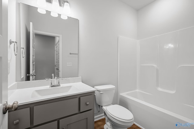 full bathroom with shower / bathtub combination, vanity, and toilet