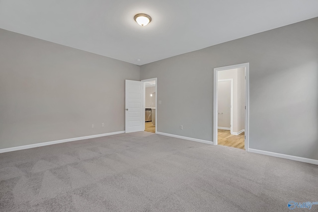 unfurnished bedroom featuring light colored carpet