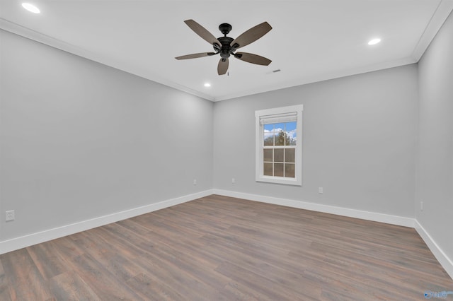 spare room with hardwood / wood-style flooring, ornamental molding, and ceiling fan