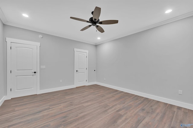 unfurnished room with hardwood / wood-style floors, ornamental molding, and ceiling fan