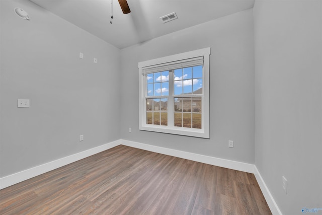 spare room featuring hardwood / wood-style floors and ceiling fan