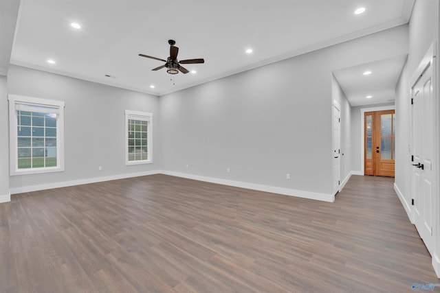 unfurnished room with ceiling fan, ornamental molding, and dark hardwood / wood-style floors