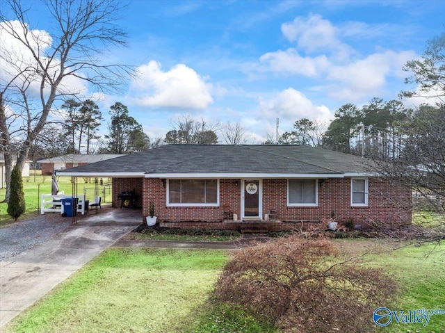 single story home featuring a carport and a front yard