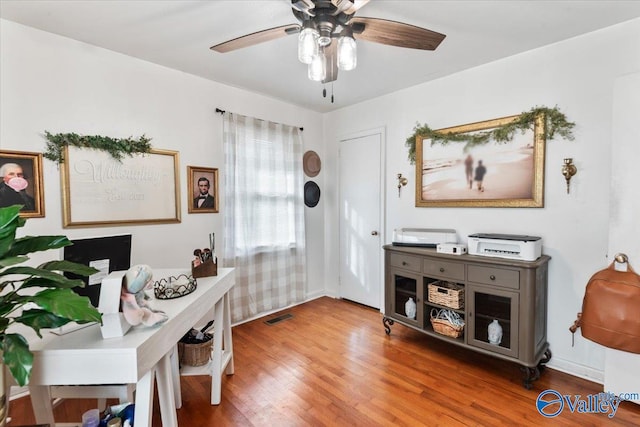 office featuring hardwood / wood-style flooring and ceiling fan