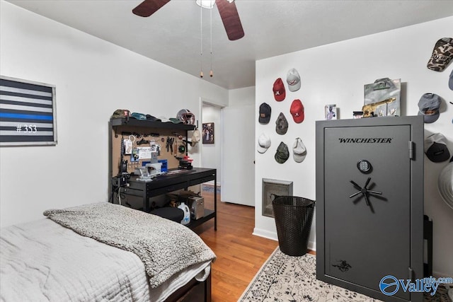 bedroom featuring ceiling fan and hardwood / wood-style floors