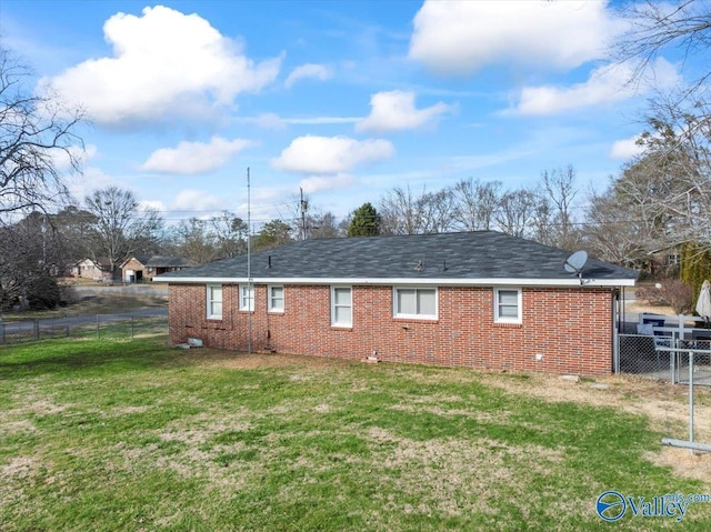 back of house with a yard