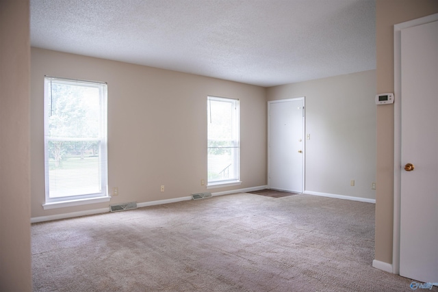 8206 SE Willowbrook Cir Unit B, Huntsville, AL 35802 - carpeted empty room with a textured ceiling and baseboards
