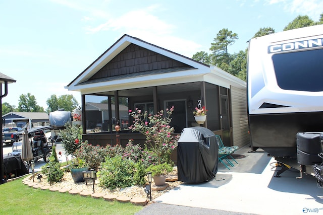 rear view of house with a sunroom