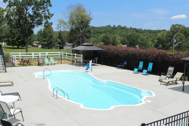 view of swimming pool featuring a gazebo and a patio area