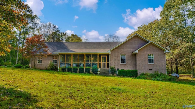 view of front of property featuring a front lawn and a sunroom